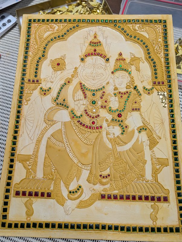 Board with raised gesso relief work and coloured stones set in place