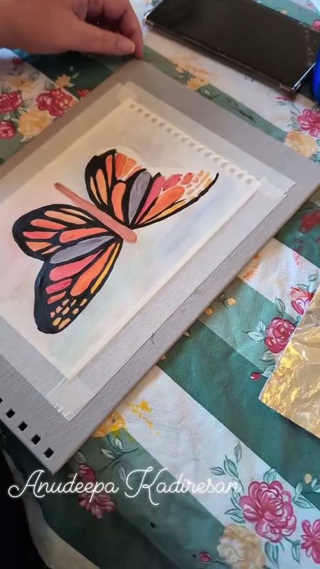 Watercolour painting of an orange butterfly