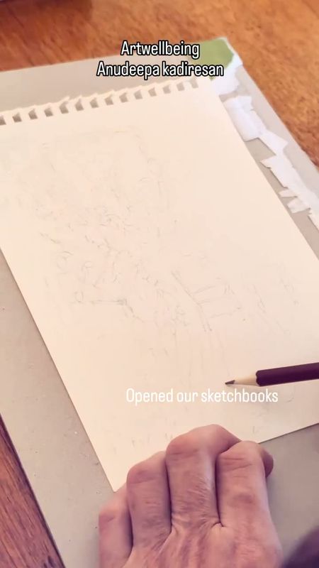 A sketchbook page being drawn outdoors