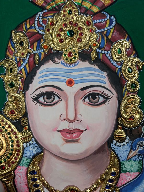 Close-up of Murugan's face in a Tanjore painting