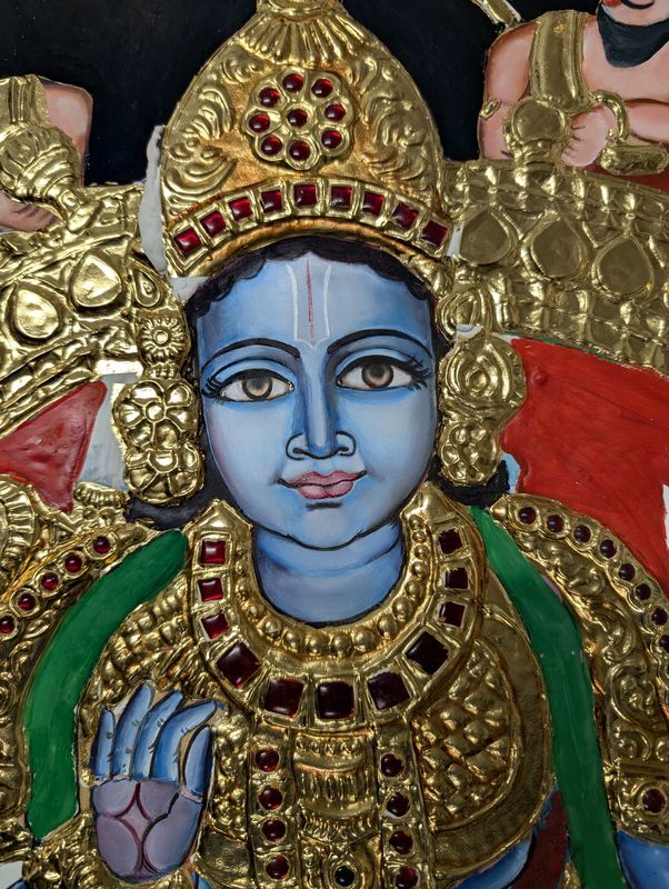 Detail of a Tanjore painting with raised gold work