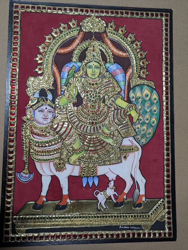 Tanjore painting of the goddess seated on Kamadhenu, with gold relief and stones