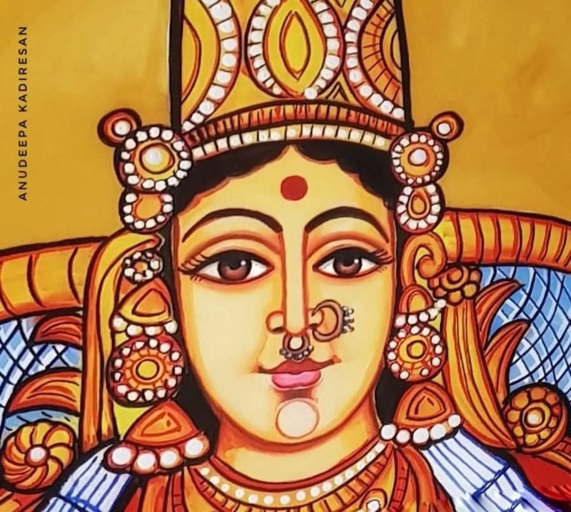 Painted goddess face with a red bindu and nose ring